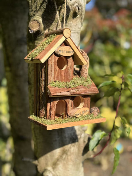 Handmade wooden birdhouse hut with three entrances measuring 16 x 10 x 21cm