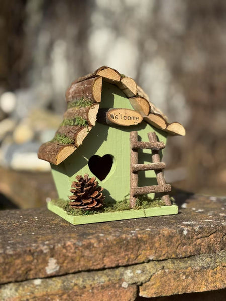 Handmade wooden coloured birdhouse hut with adorable heart shaped bird hole and ladder. The measurements are 17 x 11.5 x 17cm