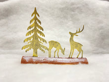 Load image into Gallery viewer, Handmade Christmas gold scene with two reindeers and Christmas tree on a wooden log 27 x 5 x 22cm
