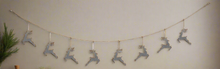 Load image into Gallery viewer, Handmade powder coated hanging silver reindeer garland measuring 150 x 22x 1cm
