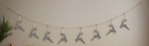 Handmade powder coated hanging silver reindeer garland measuring 150 x 22x 1cm