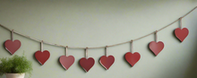 Load image into Gallery viewer, Handmade powder coated hanging red heart garland measuring 150 x 20 x 1cm
