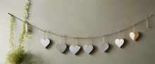 Load image into Gallery viewer, Handmade powder coated hanging silver heart garland measuring 150 x 20 x 1cm
