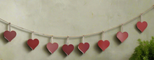 Load image into Gallery viewer, Handmade powder coated hanging red heart garland measuring 150 x 20 x 1cm
