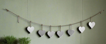 Load image into Gallery viewer, Handmade powder coated hanging silver heart garland measuring 150 x 20 x 1cm
