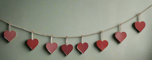 Handmade powder coated hanging red heart garland measuring 150 x 20 x 1cm