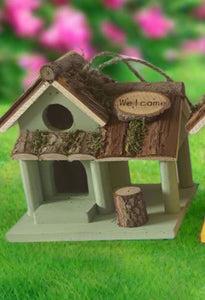 Handmade wooden coloured birdhouse hut with circular window and doorway measuring 15x11x14cm - Marissa's Garden & Gift