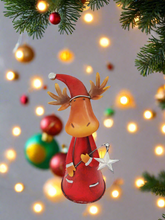 Load image into Gallery viewer, Handmade nodding reindeer with Christmas star measuring 15 x 10 x 25cm
