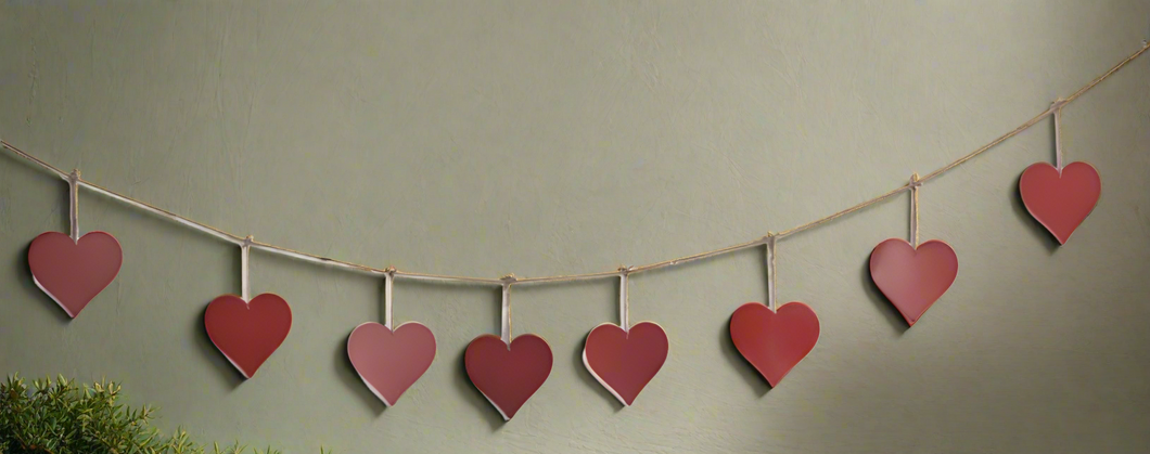 Handmade powder coated hanging red heart garland measuring 150 x 20 x 1cm