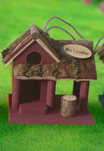 Load image into Gallery viewer, Handmade wooden coloured birdhouse hut with circular window and doorway measuring 15x11x14cm - Marissa&#39;s Garden &amp; Gift
