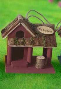 Handmade wooden coloured birdhouse hut with circular window and doorway measuring 15x11x14cm - Marissa's Garden & Gift