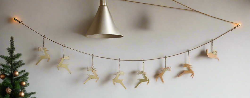 Handmade powder coated hanging gold reindeer garland measuring 150 x 22x 1cm