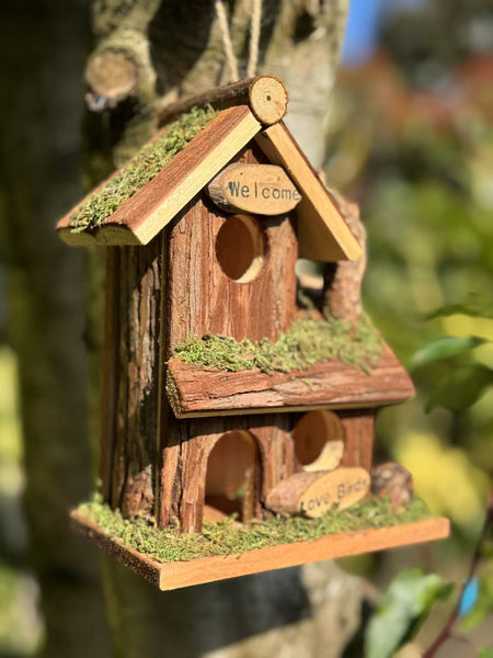 Handmade wooden birdhouse hut with three entrances measuring 16 x 10 x 21cm