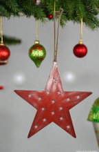 Load image into Gallery viewer, Handmade powder coated hanging red star measuring 45 x 45 x 1cm
