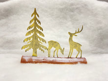 Load image into Gallery viewer, Handmade Christmas gold scene with two reindeers and Christmas tree on a wooden log 27 x 5 x 22cm
