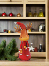 Load image into Gallery viewer, Handmade nodding reindeer with Christmas star measuring 15 x 10 x 25cm
