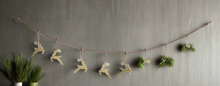 Load image into Gallery viewer, Handmade powder coated hanging gold reindeer garland measuring 150 x 22x 1cm
