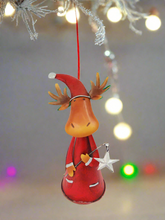 Load image into Gallery viewer, Handmade nodding reindeer with Christmas star measuring 15 x 10 x 25cm
