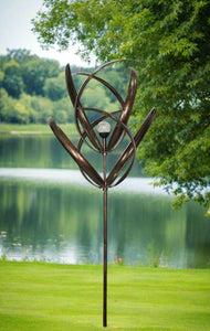 knightsbridge Bronze windsculpture/windspinner with solar bulb measuring 61 x 61 x 208cm