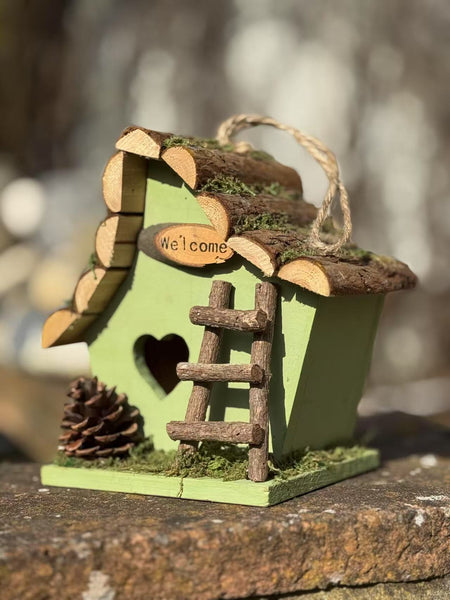 Handmade wooden coloured birdhouse hut with adorable heart shaped bird hole and ladder. The measurements are 17 x 11.5 x 17cm