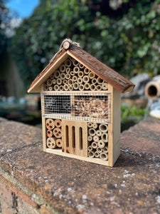 Handmade wooden house shaped large insect house