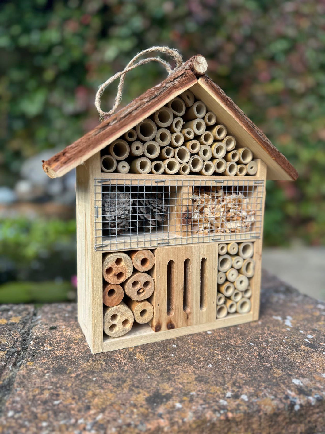 Handmade wooden house shaped large insect house