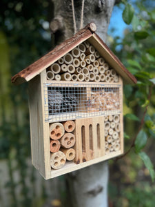 Handmade wooden house shaped large insect house