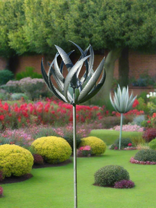 Burghley garden wind sculpture spinner silver with black brush